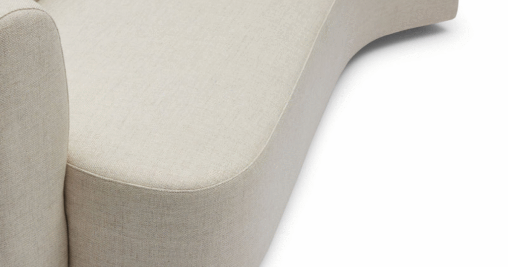 The Celine sofa lounge features organic, curved surfaces, creating flow and emotional connection through effective property styling.