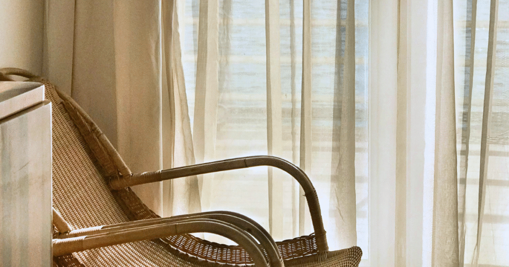 Textures outperform cliches in property styling for coastal applications, where rattan, timber, and linen create sophisticated, livable spaces.